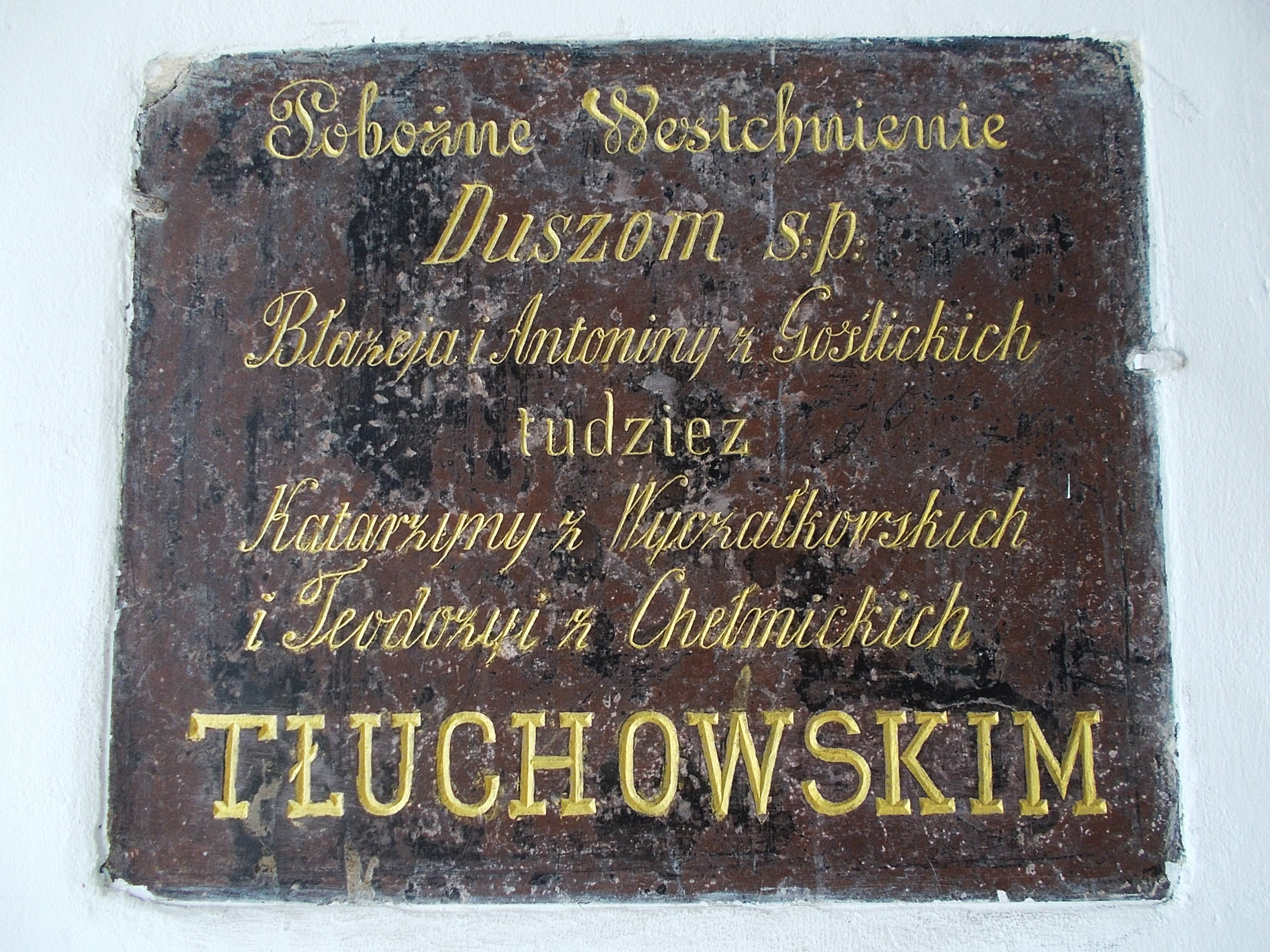 Tablica upamitniajca Baeja Tuchowskiego i jego trzy ony w kociele w. Jana w Pocku